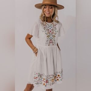 Pando Grove sundress with floral embroidery.
